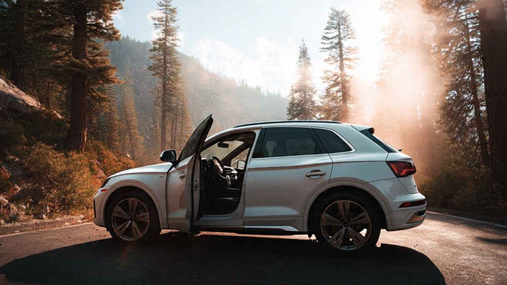 2026 Audi Q5 parked on a scenic mountain highway with forest in background