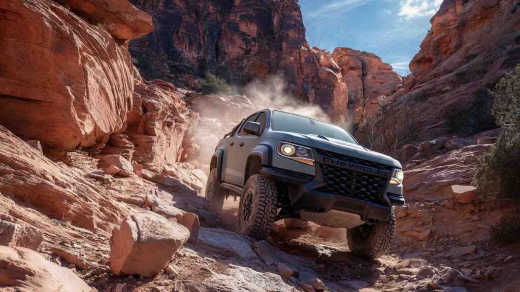 2026 Chevrolet Colorado ZR2 climbing a rocky trail in red rock canyon country