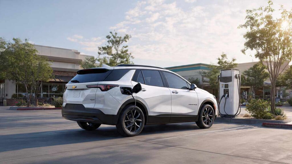 2026 Chevrolet Equinox EV charging at a public DC fast charger in a suburban parking lot